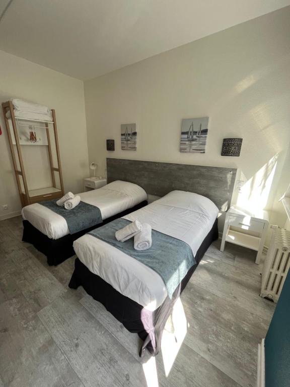 Postel nebo postele na pokoji v ubytování Hôtel Agena