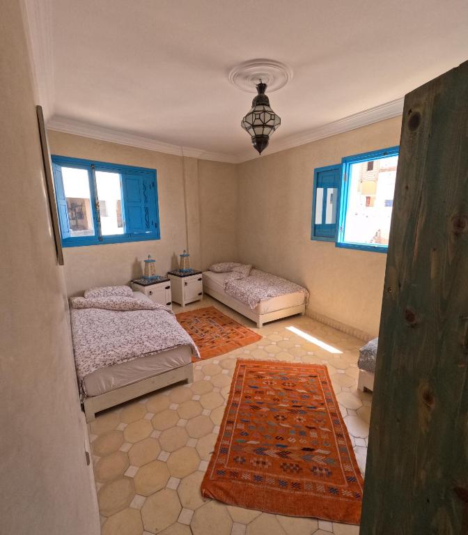 Postel nebo postele na pokoji v ubytování Taghazout Ocean View