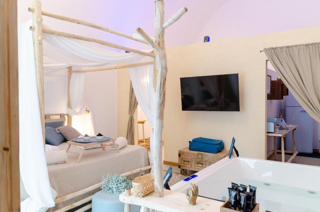 Postel nebo postele na pokoji v ubytování Oppure - Centro Città Spa & Relax