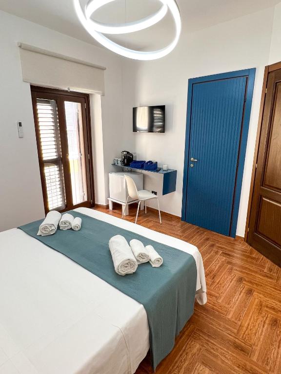 Postel nebo postele na pokoji v ubytování The Apartment Agrigento