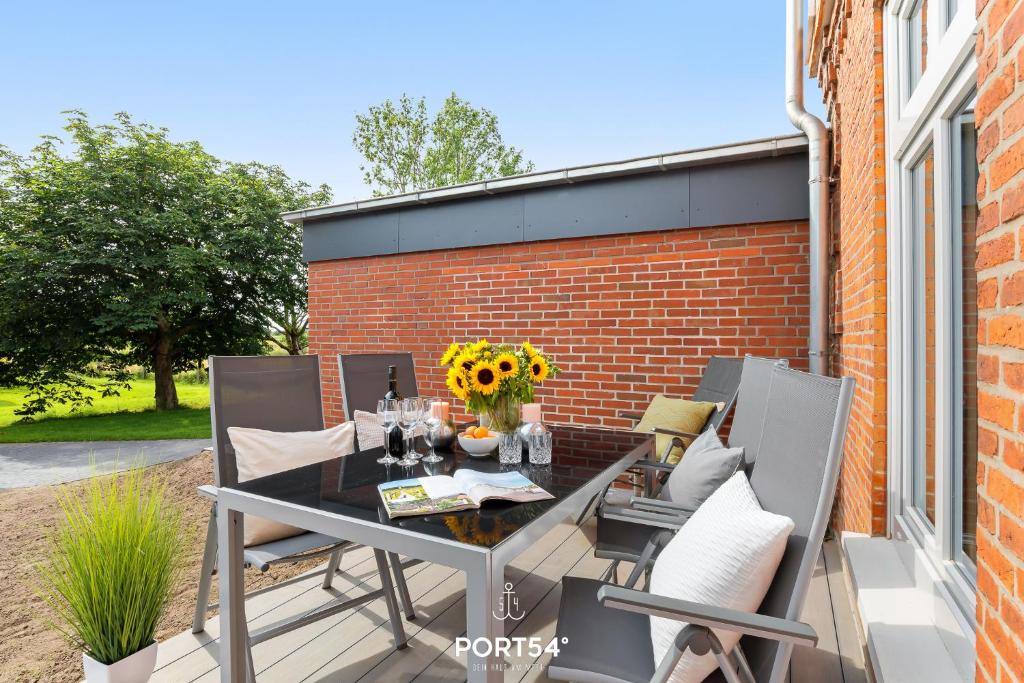 Патио или другая зона на открытом воздухе в Ferienwohnung Vogelsang, App 5 Emmelsbüll