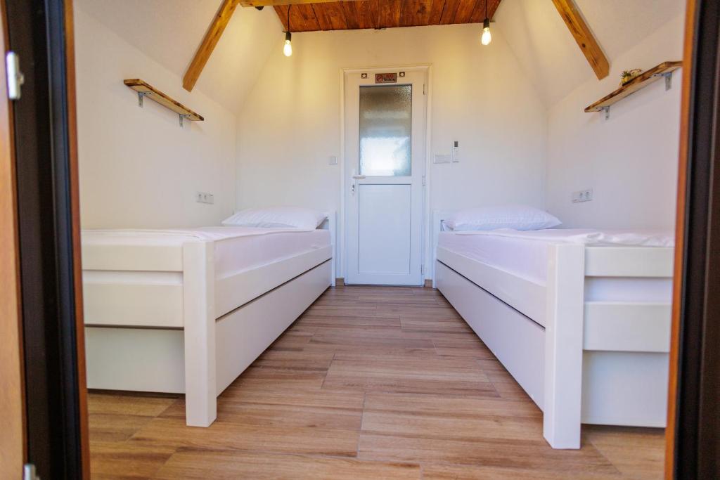 Postel nebo postele na pokoji v ubytování Resort La Familia