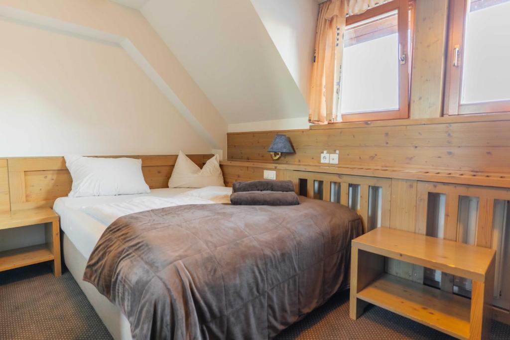 Postelja oz. postelje v sobi nastanitve Hotel Krvavec