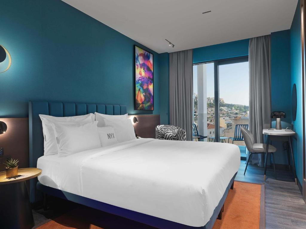 Postel nebo postele na pokoji v ubytování NYX Esperia Palace Hotel Athens by Leonardo Hotels