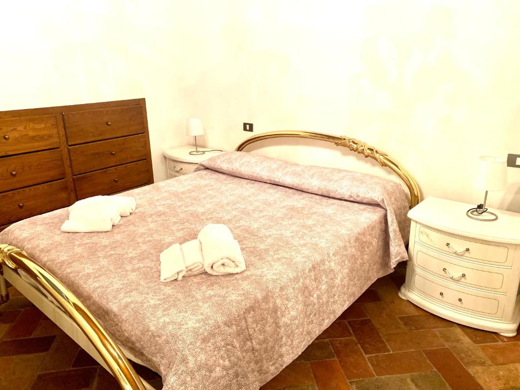 Posteľ alebo postele v izbe v ubytovaní Casa di Viola