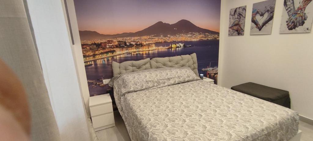 a bedroom with a bed with a view of a city at Dantonarooms in Naples