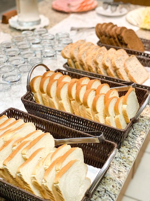 a buffet of breads and pastries on a table at Hotel Raul's in Gaspar