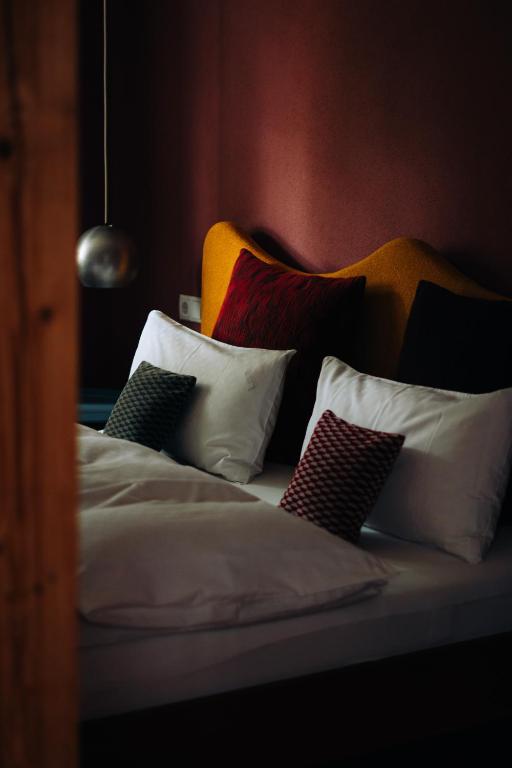 Postel nebo postele na pokoji v ubytování Molo Rouge - Boutiquehotel & Café