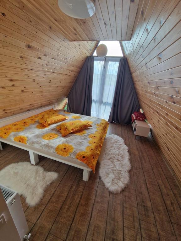 Postel nebo postele na pokoji v ubytování Pensiunea Fata Viilor