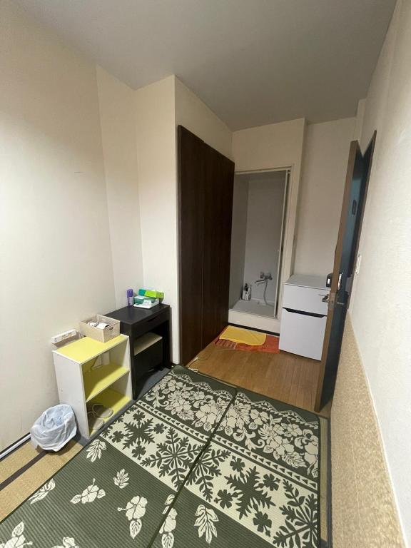 Postel nebo postele na pokoji v ubytování Shinjuku Sky hostel