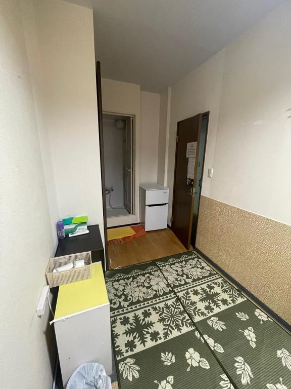 Postel nebo postele na pokoji v ubytování Shinjuku Sky hostel