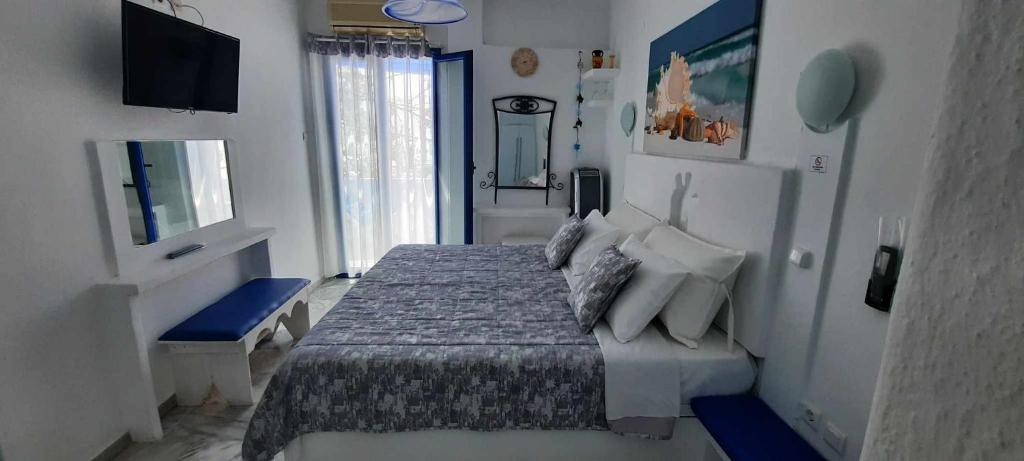 Postel nebo postele na pokoji v ubytování Doron Hotel Delfini