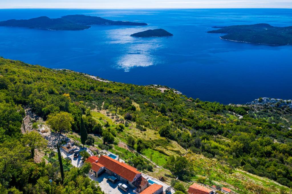 an aerial view of the island of šibenica at Amber's Place: cosy house with pool and sea views in Dubravica