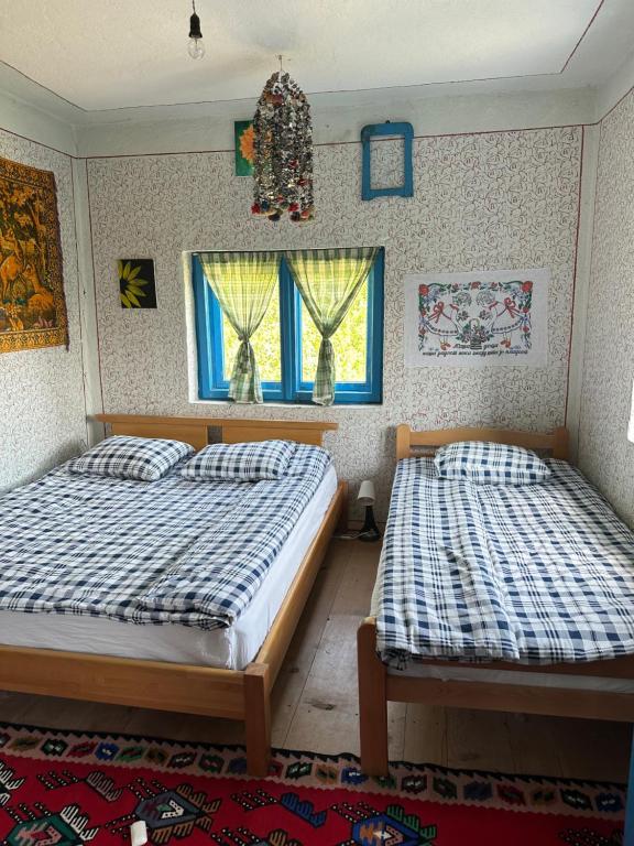 Postel nebo postele na pokoji v ubytování Etno kuća Krvavac