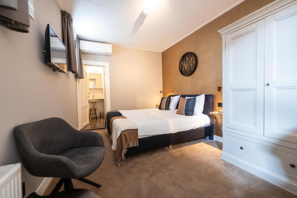 Postel nebo postele na pokoji v ubytování Hotel Montfoort