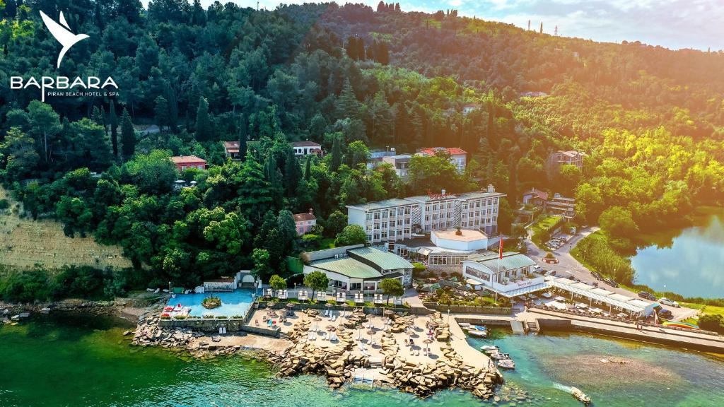 an aerial view of a resort next to a body of water at Barbara Piran Beach Hotel in Piran