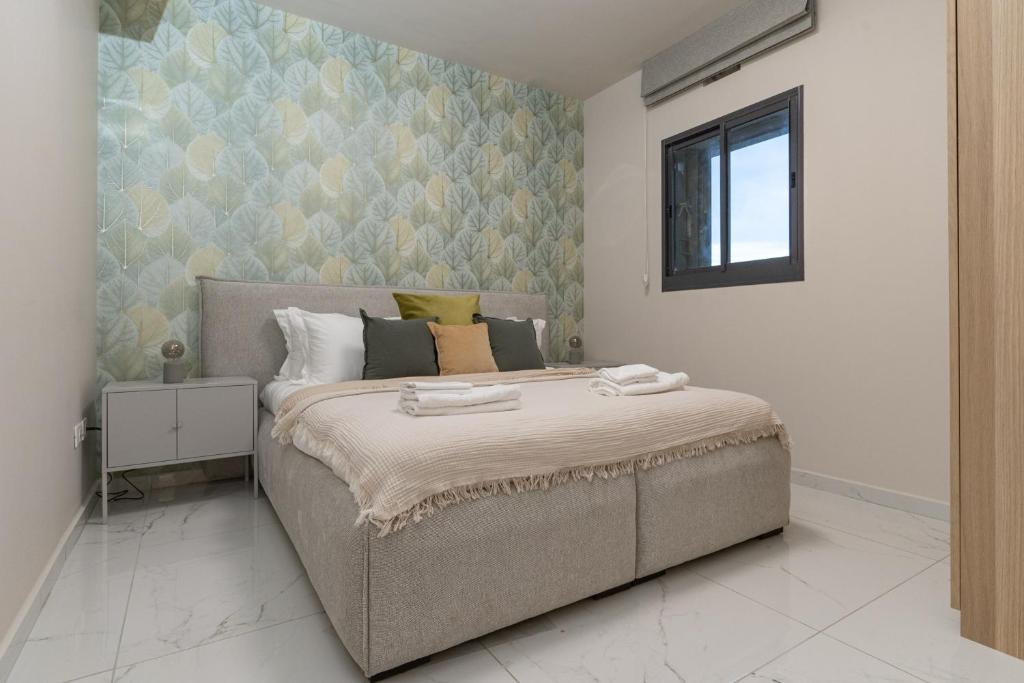 a bedroom with a large bed in a room at luxury studio flat in Jerusalem