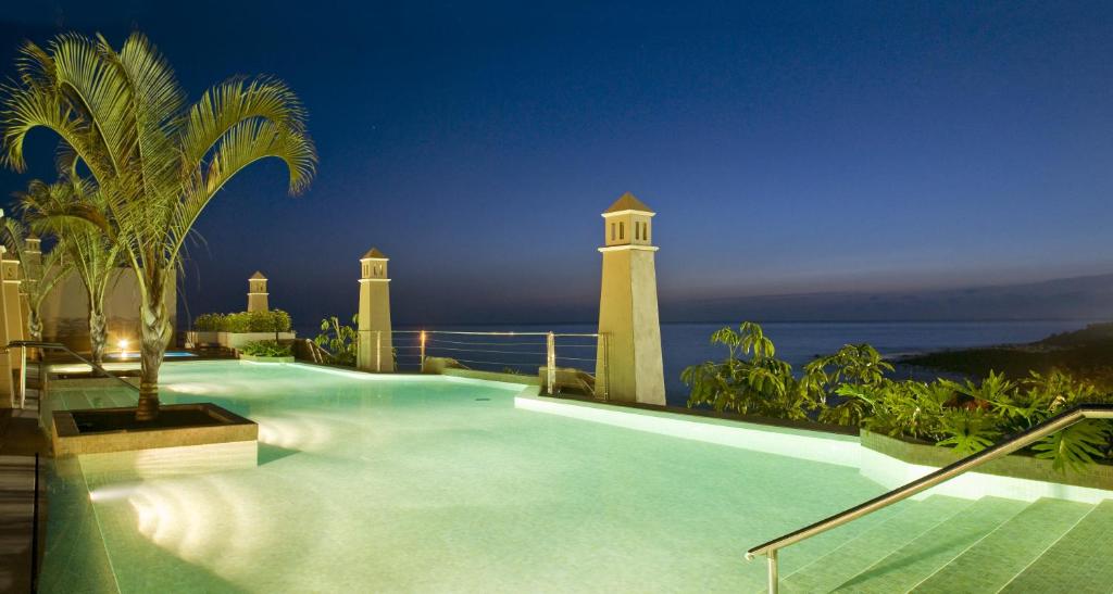 a swimming pool with a view of the ocean at Hotel Playa Calera in Valle Gran Rey