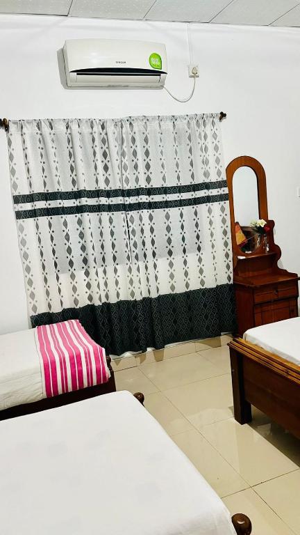Postel nebo postele na pokoji v ubytování Village feel home stay
