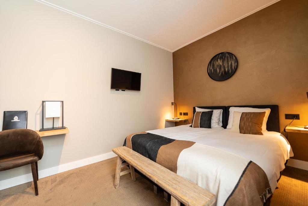 Postel nebo postele na pokoji v ubytování Hotel Montfoort