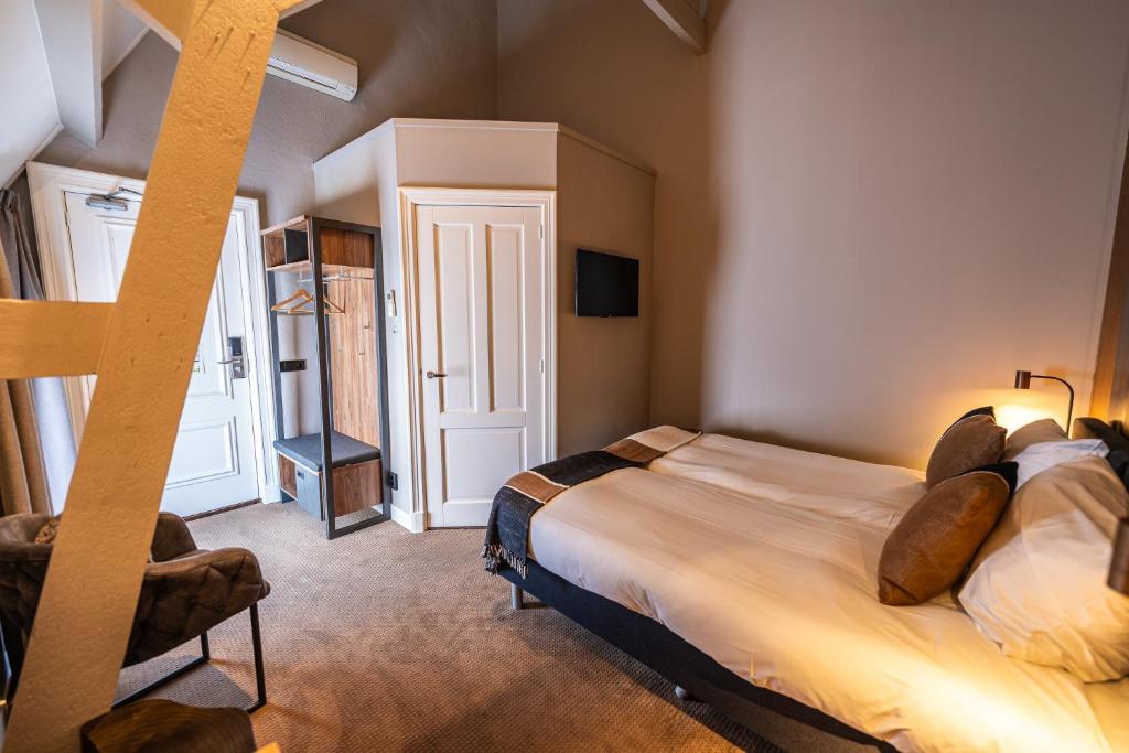 Postel nebo postele na pokoji v ubytování Hotel Montfoort