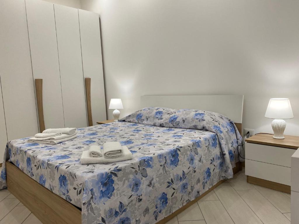 Ένα ή περισσότερα κρεβάτια σε δωμάτιο στο Casa Filomena