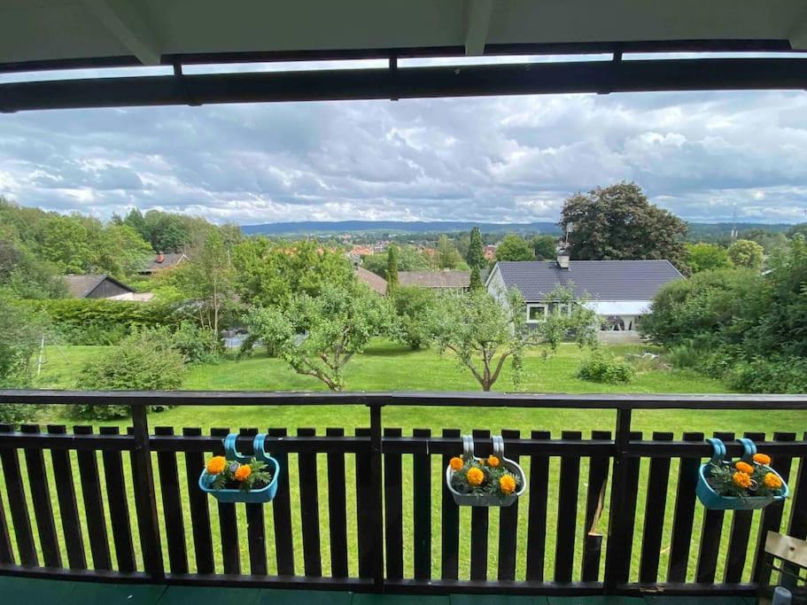 a view from the balcony of a house with fruitemen at Swden Sunne in Sunne