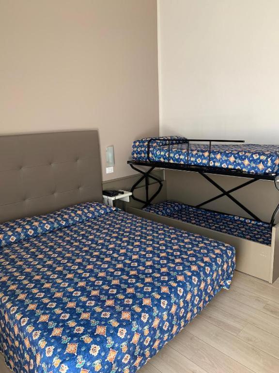 Postel nebo postele na pokoji v ubytování Hotel Madera