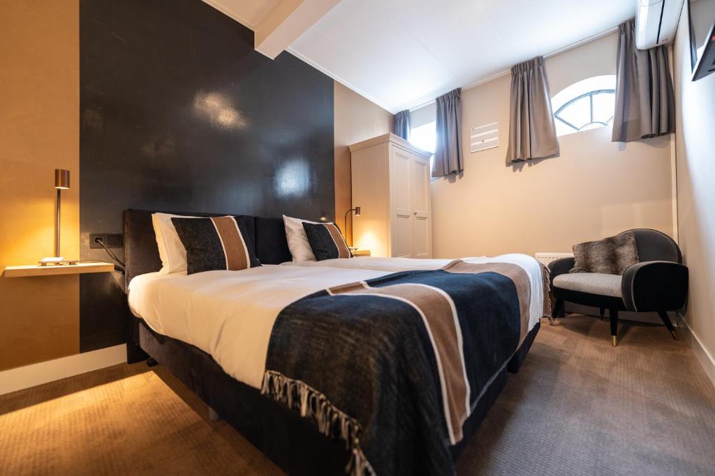 Postel nebo postele na pokoji v ubytování Hotel Montfoort