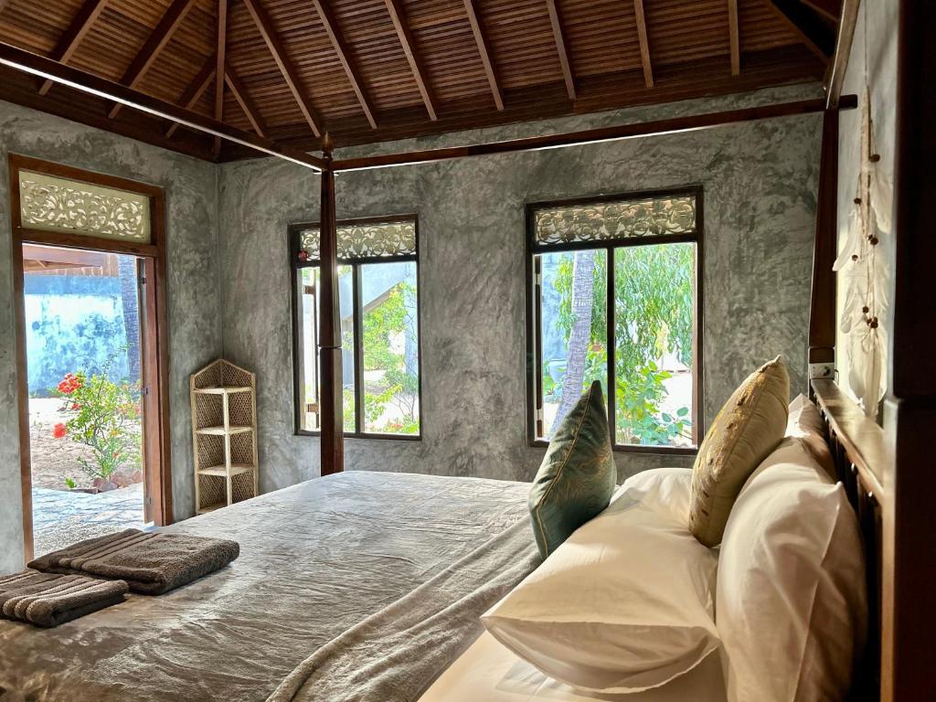 Postel nebo postele na pokoji v ubytování Arasi Resort