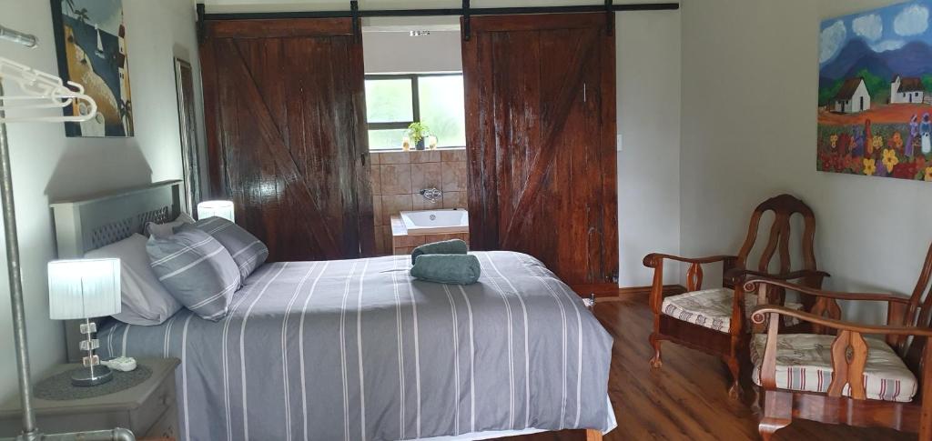 Postel nebo postele na pokoji v ubytování Berlouri Guest House