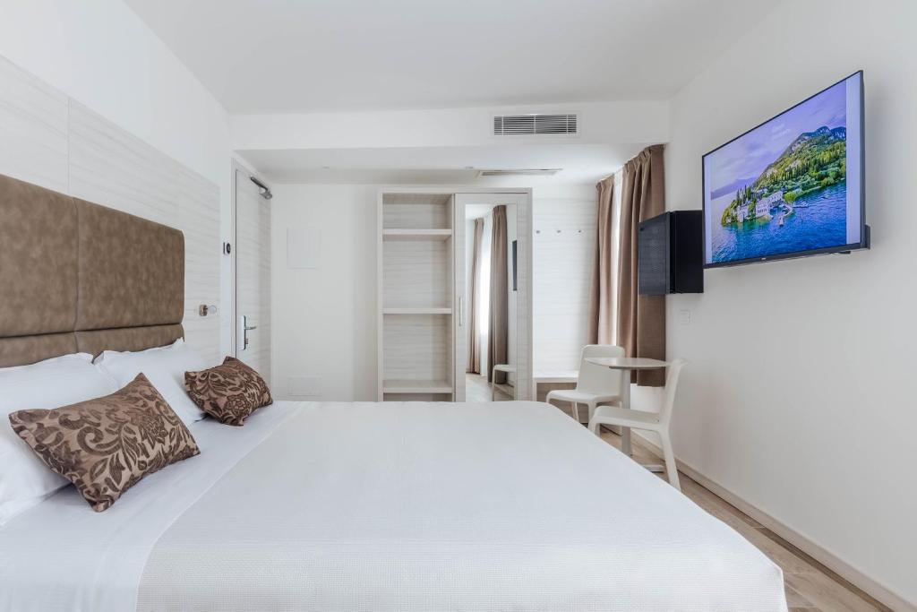 Posteľ alebo postele v izbe v ubytovaní Hotel Giardinetto