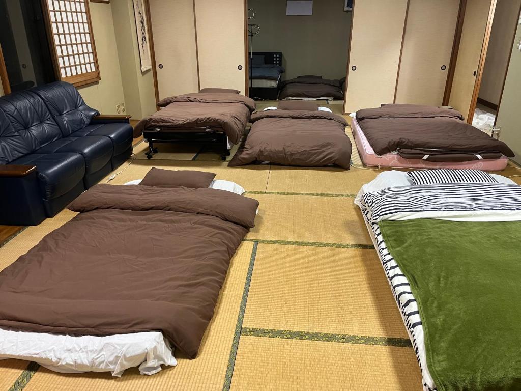 Voodi või voodid majutusasutuse 民宿ふじ苑 toas