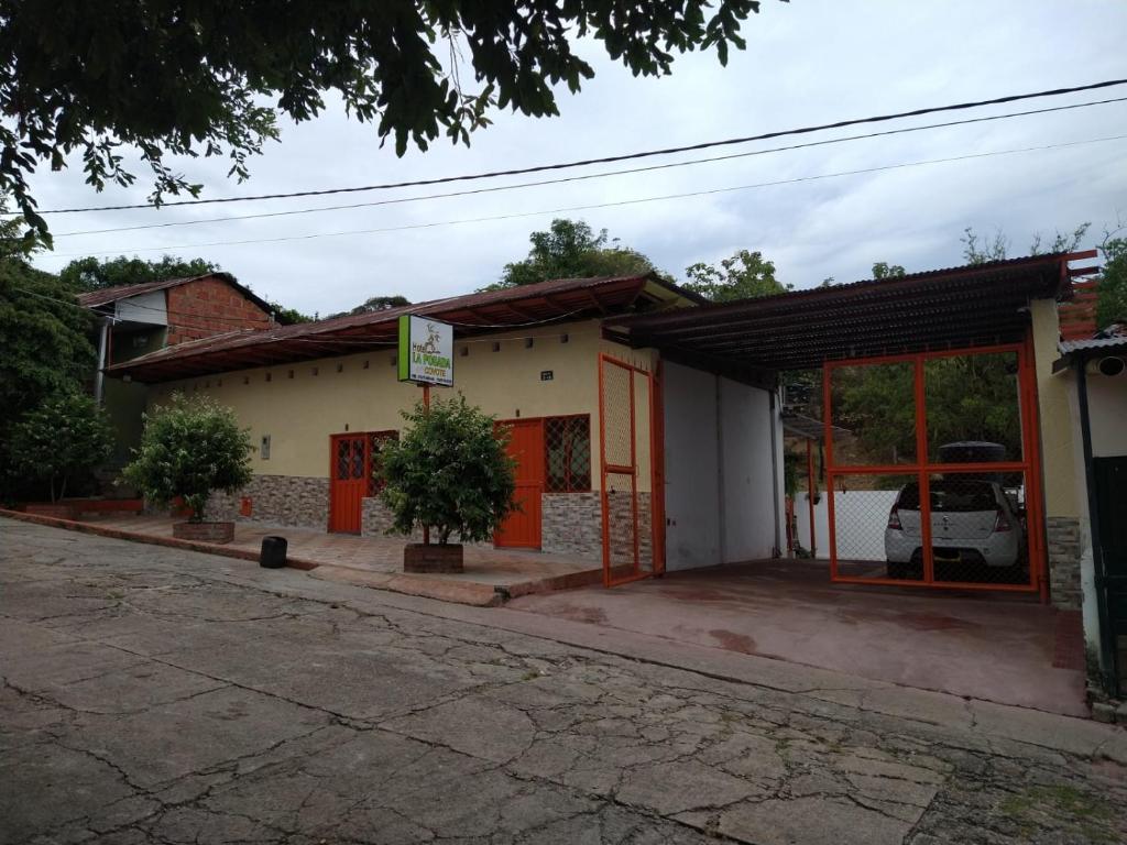 a building with orange doors on a street at La Posada Del Coyote in Ortega