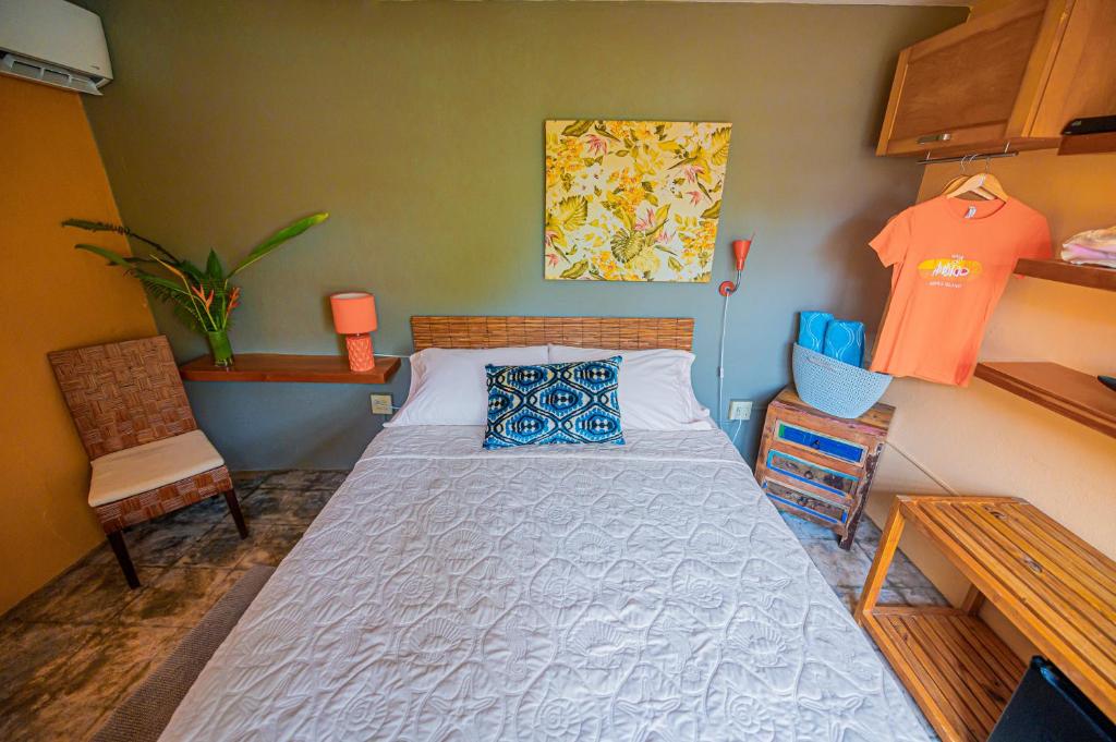 Postel nebo postele na pokoji v ubytování Casa de Amistad Guesthouse