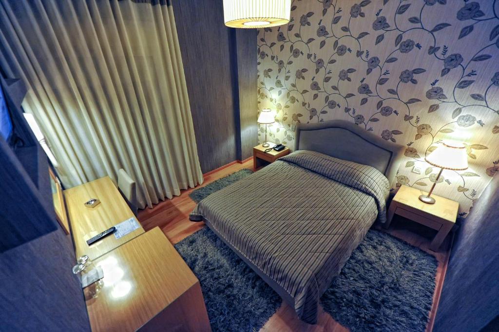 Postel nebo postele na pokoji v ubytování Haikos Hotel
