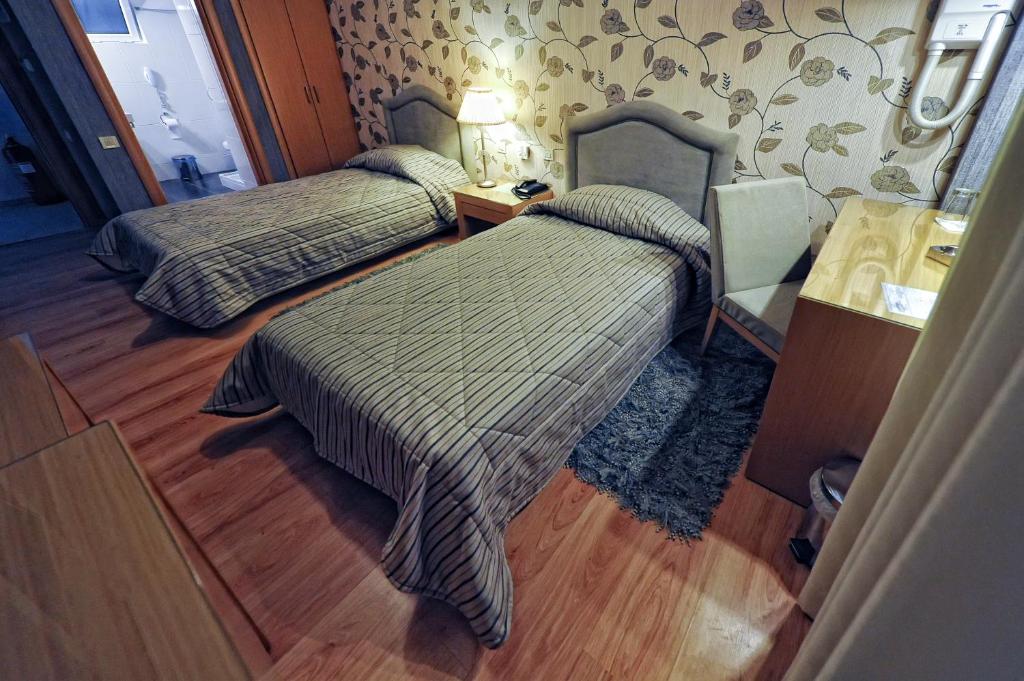 Postel nebo postele na pokoji v ubytování Haikos Hotel