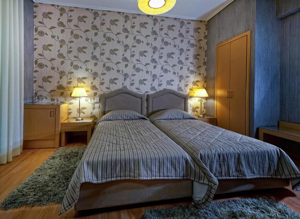 Postel nebo postele na pokoji v ubytování Haikos Hotel