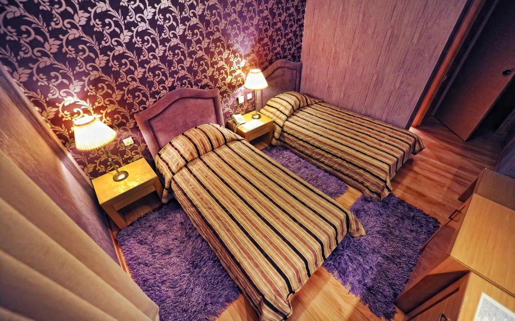 Postel nebo postele na pokoji v ubytování Haikos Hotel