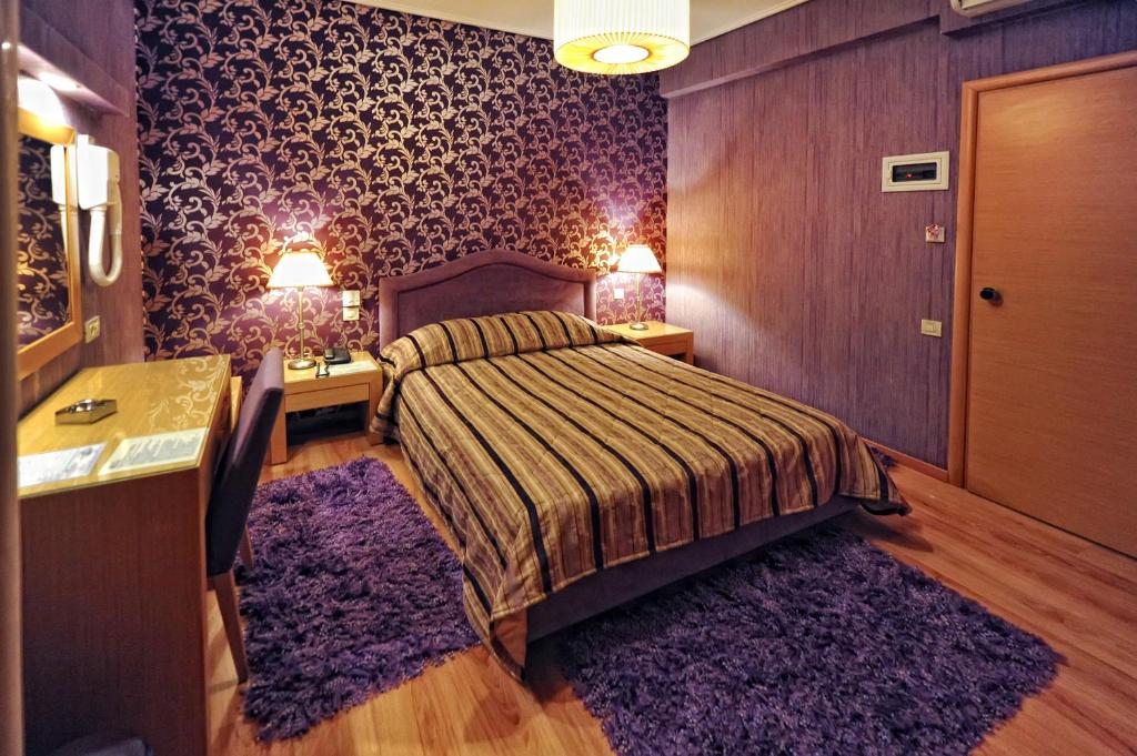 Postel nebo postele na pokoji v ubytování Haikos Hotel