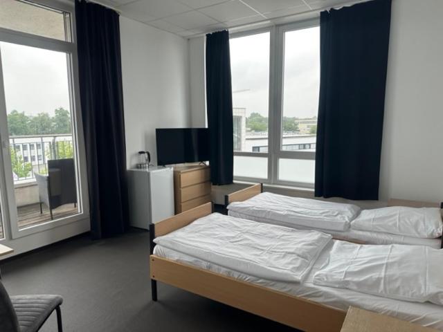 Postel nebo postele na pokoji v ubytování Arena Hostel & Monteurzimmer