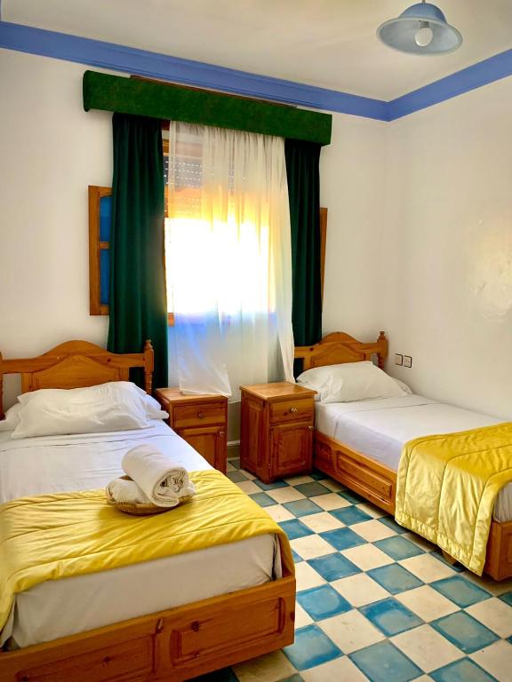 Voodi või voodid majutusasutuse Hôtel Al Kalaa toas