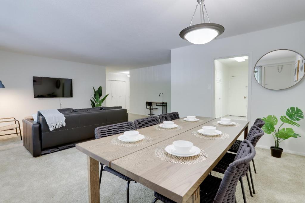 a living room with a table and a couch at Luxury apartment at Crystal City with Amazing Amenities in Arlington