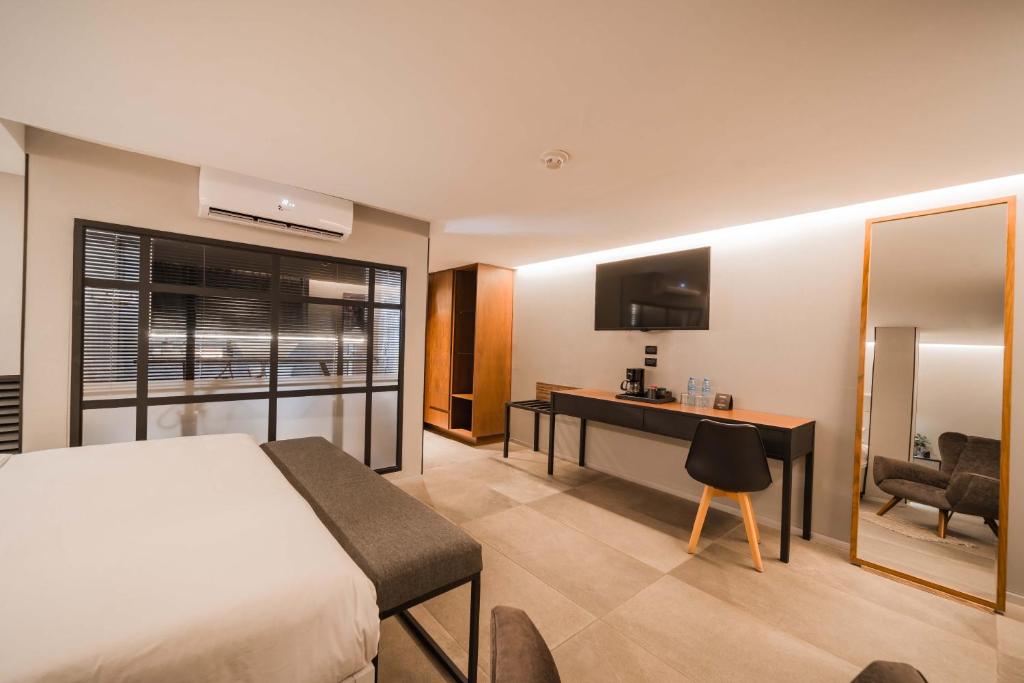 TV a/nebo společenská místnost v ubytování Ontico Urban Design Hotel