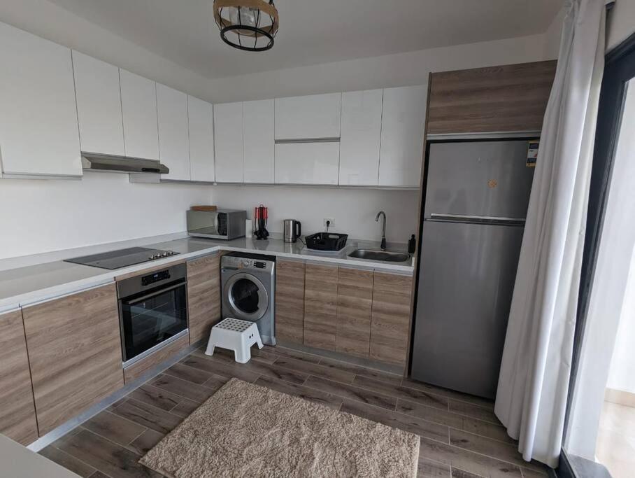 Kuchyň nebo kuchyňský kout v ubytování Somabay Retreat 2BR Apartment