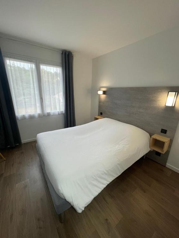 Postel nebo postele na pokoji v ubytování Hotel Castel