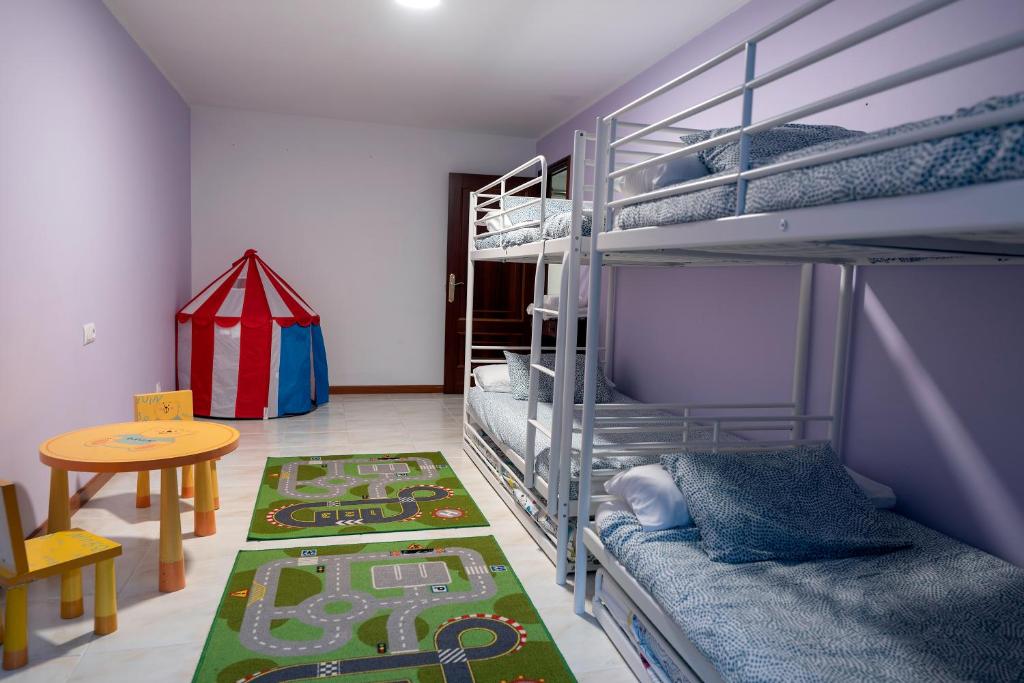 Postel nebo postele na pokoji v ubytování A Bruxiña de Toldaos