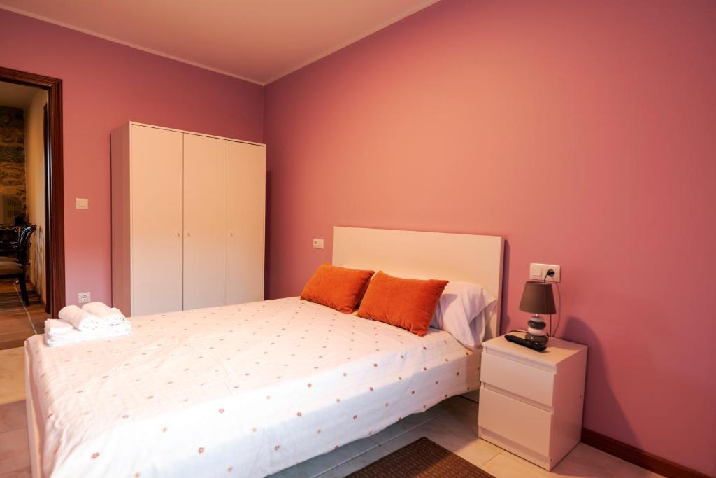 Postel nebo postele na pokoji v ubytování A Bruxiña de Toldaos