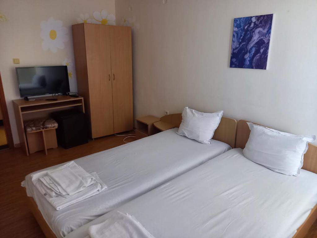 Postel nebo postele na pokoji v ubytování хотел Централ