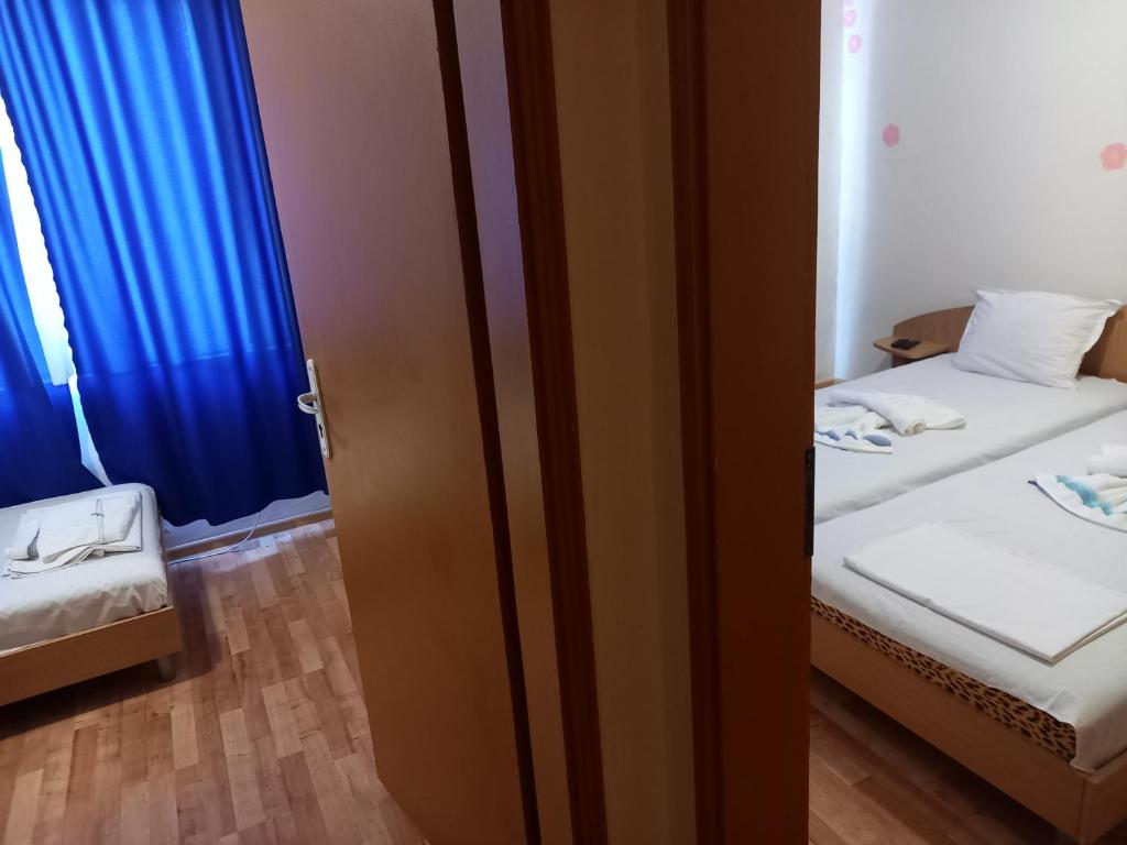 Postel nebo postele na pokoji v ubytování хотел Централ